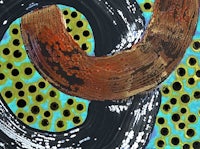 a painting of a ring with polka dots on it